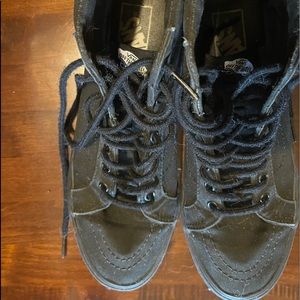 High top black vans.